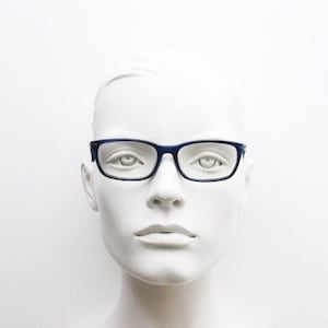 Calvin Klein rectangular low profile eye glasses. Dark navy blue gloss acetate optical frames. Prescription eyeglasses. RX