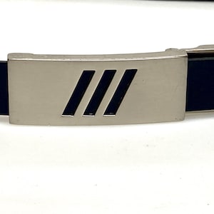 90s vintage smart trouser belt. Thick eco vinyl in black shiny finish with steel buckle with cutouts. Seamless no holes design. Mens NOS