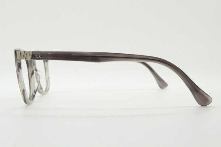 Shallow Rectangular Spectacles Calvin Klein Rectangular Eye Glasses. Unisex Transparent Grey Gloss ...