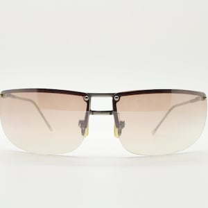 Y2K vintage visor sunglasses. Flat top half frame wraparound shield design with light tone graduating curved lenses. 2000&#39;s. NOS