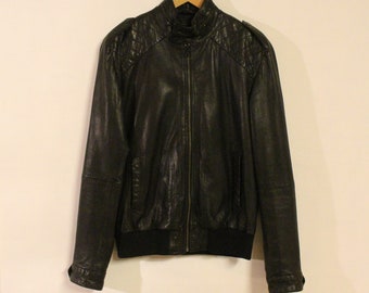 Vintage black genuine leather jacket. Mens round collar zipper bomber with quilted shoulders Vintage black genuine leather jacket. Mens round collar zipper bomber with quilted shoulders