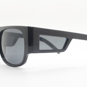 Y2K vintage rectangular side panel sunglasses. Black gloss frame with grey lenses and side window spoilers / blinkers. 2000s NOS goggle