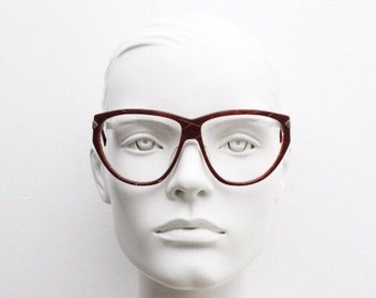 Silhouette 80s vintage oversized cat eye glasses made in Austria. Dramatic red prescription optical frame with subtle criss cross stripes RX