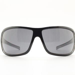Y2k vintage wrap around large square sunglasses. Curved black shield frame with tasteful striped interior. 1960s bug eye design. 2000&#39;s NOS