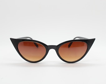 Y2K vintage pointed cat eye sunglasses. Womens black slender 50s style frame with Havana brown lenses. Rockabilly, bad girl pin up