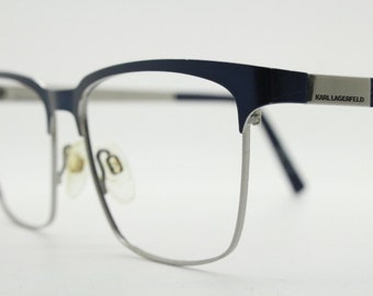 Karl Lagerfeld squared wayfarer shape eye glasses. Navy check pattern arms with satin finish brow optical frames. Prescription eyeglasses.