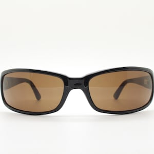 Y2k vintage wrap around rectangular sunglasses. Low profile curved black gloss frame with plain brown lenses. 2000&#39;s bug eye. NOS