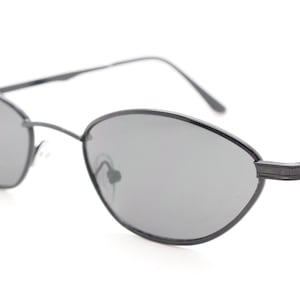 90s vintage low profile sunglasses. Minimal small black angular oval metal frame with matching lenses, Unused. BNWT