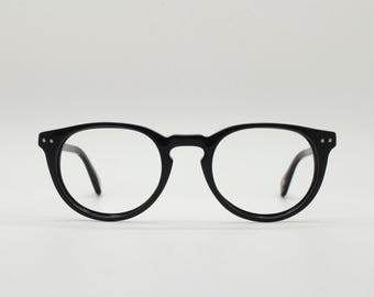 90s vintage oval eye glasses by Alles Brille of Germany. Classical black gloss acetate optical frames with keyhole bridge. RX Spectacles