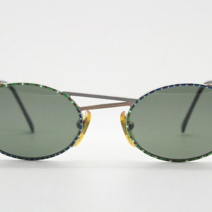 Taxi 90s vintage oval sunglasses. Unique innovative abstract design with extraordinary multi colour print. Casanova