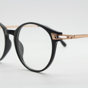 90s vintage round glasses with embossed gold  arms. Black 40s, 50s style prescription optical frames. Clear lens eyeglasses. RX spectacles