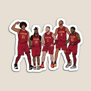 May include: Five basketball players wearing red and gold uniforms with the word "Cleveland" on their jerseys. The players are in various poses, with their numbers visible: 31, 10, 1, 4, and 45.