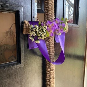 Cross shaped wreath wrapped with braided rope and draped with purple ribbon image 2