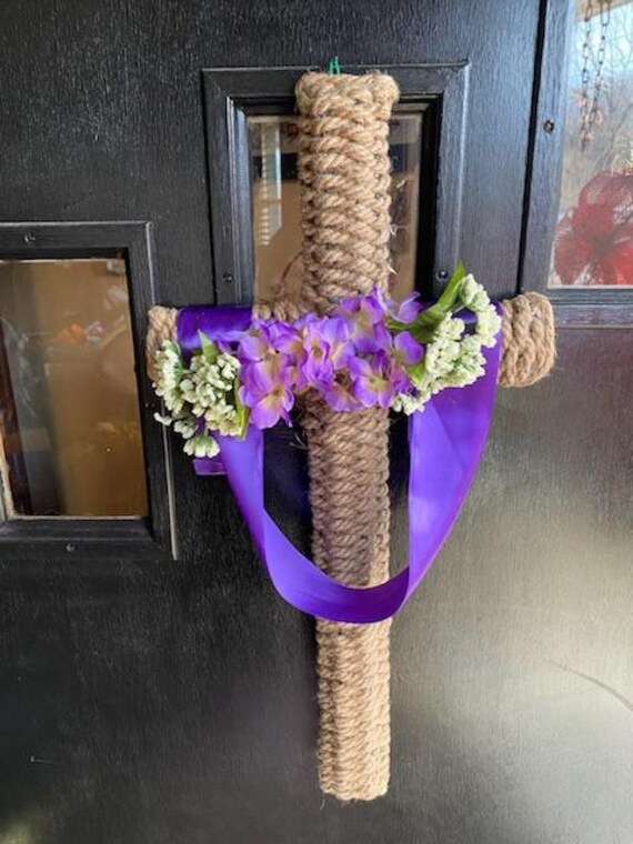 Cross Shaped Wreath Wrapped With Braided Rope and Draped With Purple Ribbon  