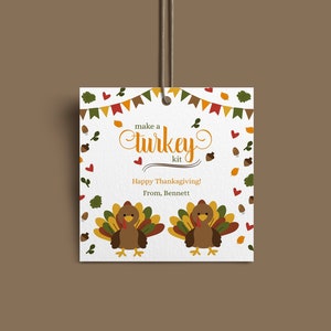 May include: A white card with a brown turkey illustration and the text "make a turkey kit" in brown script. The card also has the text "Happy Thanksgiving! From, Bennett" in black text.