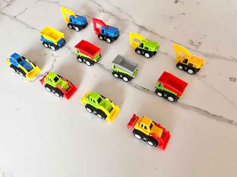 May include: A collection of ten toy construction vehicles, including dump trucks, excavators, and bulldozers. The vehicles are made of plastic and are painted in various colors, including yellow, green, red, blue, and gray.