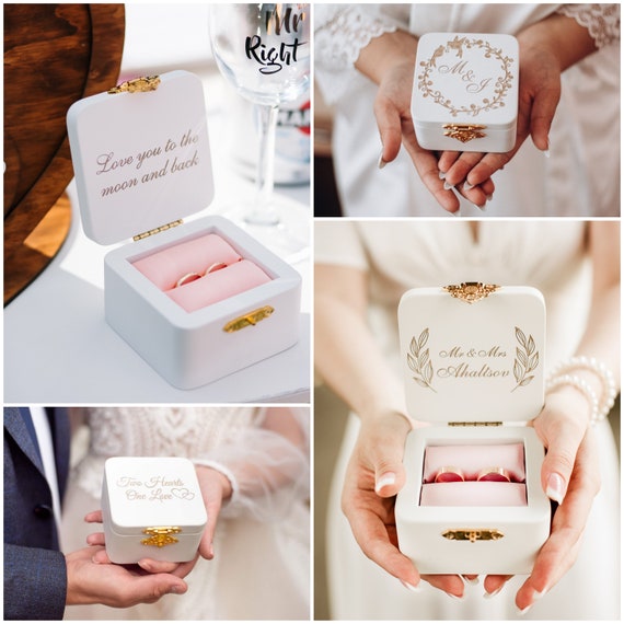 Wedding rings in the jewelry box at the wedding ceremony Stock Photo by  Lobachad