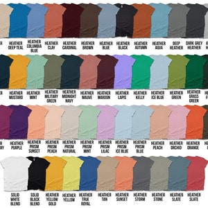 May include: A chart of 50 different heather colors for t-shirts. The colors are arranged in rows and columns, with the names of each color listed below. The colors include heather dust, deep teal, columbia blue, clay, cardinal, brown, blue, black, autumn, aqua, deep heather, dark grey heather, athletic heather, navy, mustard, mint, military green, midnight navy, mauve, maroon, lapis, kelly, ice blue, green, grass green, forest, raspberry, purple, prism sunset, prism peach, prism natural, prism mint, prism lilac, prism ice blue, prism blue, peach, orchid, orange, olive, solid white blend, solid black blend, heather yellow gold, heather yellow, true royal, tan, sunset, storm, stone, slate, slate.