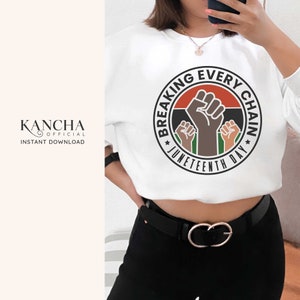 May include: White sweatshirt with a black circle graphic that says "Breaking Every Chain Juneteenth Day" with a raised fist and three other fists in the background.