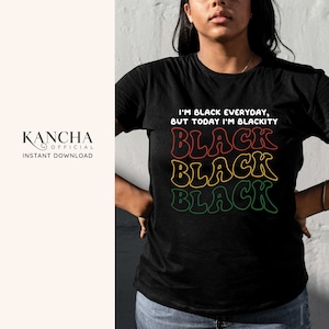May include: Black t-shirt with the text "I'm Black Everyday, But Today I'm Blackity" and three stacked words "Black" in red, yellow, and green.