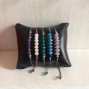 Crystal Faceted Beads Bracelet on S Lon Cord with Small Faceted Colored Metal Bead