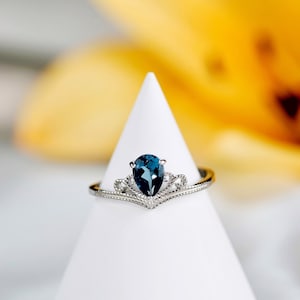 Natural Teardrop London Blue Topaz Ring: Princess Crown Sterling Silver, Adjustable