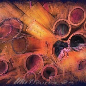 May include: Abstract digital art featuring a collection of overlapping rusty orange and purple pipes. The pipes are arranged in a chaotic pattern, creating a sense of depth and dimension.