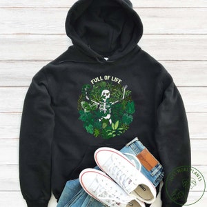 May include: Black hoodie featuring a white skeleton surrounded by green plants and the text "Full of Life".