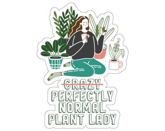May include: A sticker with a green, brown, and pink illustration of a person sitting among plants and holding a cup. The text reads "Crazy" with a line through it, "Perfectly Normal Plant Lady".