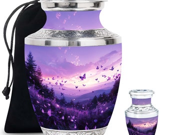 May include: A set of two silver cremation urns featuring a purple and pink sunset scene with butterflies. The larger urn comes with a black velvet bag.