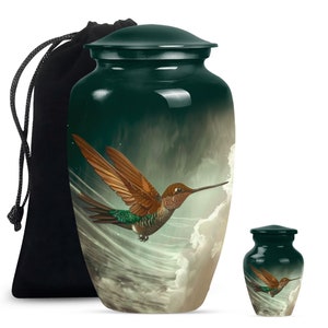 Handcrafted cremation urn with detailed hummingbird and cloud design.