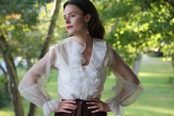 Vintage 1970s cream ruffle blouse with statement s