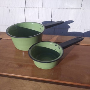 Two Vintage Green Enamel Pots with Black Handles and Trim