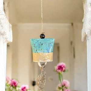 Earthly Melodies: Handcrafted Ceramic Harmony Cenote Sunflower Bell