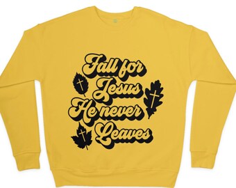 May include: Yellow sweatshirt with black text that reads "Fall for Jesus He never Leaves" with stylized leaves and crosses.