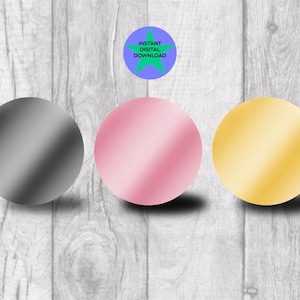 May include: Three round, metallic circles in gray, pink, and gold colors. The circles are arranged horizontally on a white wood background.