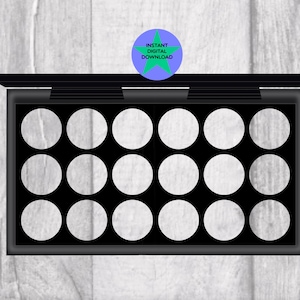 May include: Black eyeshadow palette with 15 empty round pans. The palette has a black lid and a silver trim.