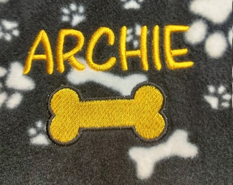 Personalised dog blanket handmade puppy dog pattern fleece blanket black with white paws and bones print cosy fleece embroidered name