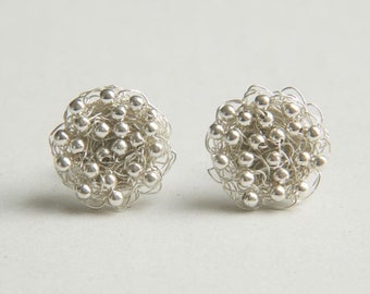 round ear studs crocheted in silver with silver balls