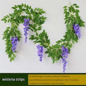 May include: Artificial wisteria strips with green leaves and purple flowers. The whole length is 2 meters, with 5 bunches of flowers, about 350 leaves, 2 bunches of long flowers (35cm in bunches), and 3 bunches of short flowers (25cm in bunches).