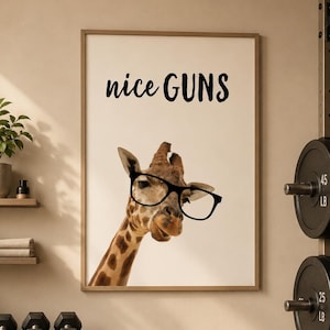 May include: A framed print featuring a giraffe wearing glasses with the text "nice GUNS". The image is set in a gym environment, with dumbbells, a weight bench, and a water bottle that says "STAY FOCUSED".