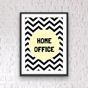 May include: Black and white chevron pattern print with a yellow circle in the center. The circle has the text "HOME OFFICE" in black.