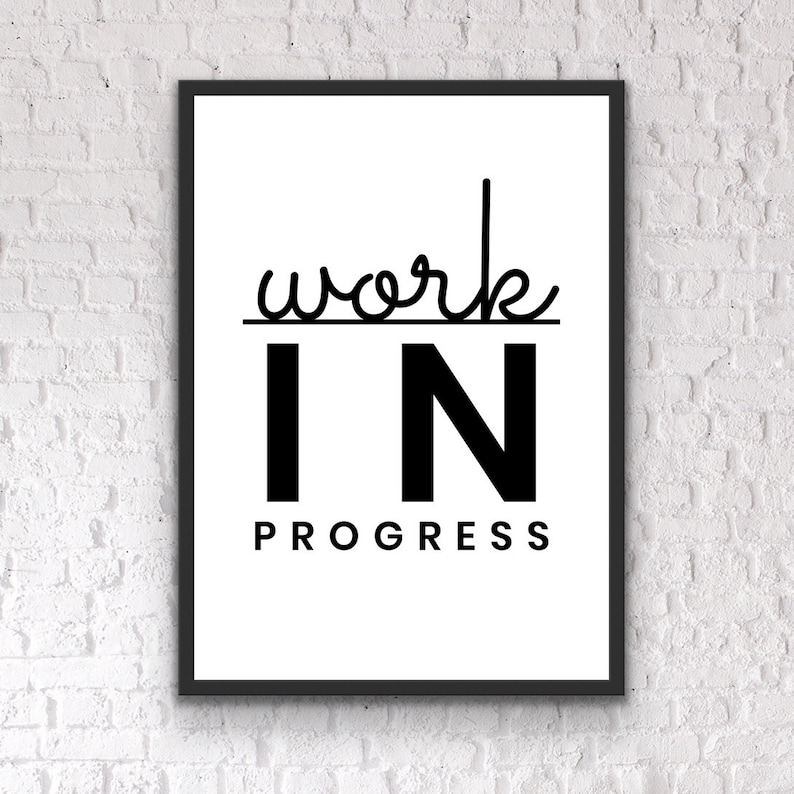 May include: Black and white framed print with the text "work in progress" in a modern font.