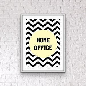 May include: A black and white chevron pattern print with a yellow circle in the center. The circle contains the text "HOME OFFICE" in black.