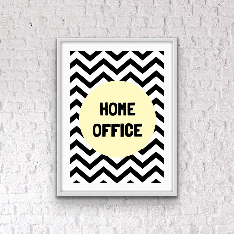 May include: A black and white chevron pattern print with a yellow circle in the center. The circle contains the text "HOME OFFICE" in black.