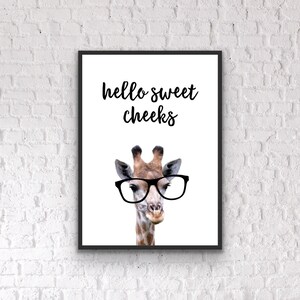 May include: A black and white printable art print with a giraffe wearing glasses and the text "hello sweet cheeks".