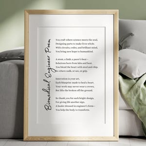 May include: A framed print with a poem titled "Biomedical Engineer Poem." The poem is in black text on a white background, within a wooden frame. The poem's theme is about biomedical engineering and its impact on healthcare.