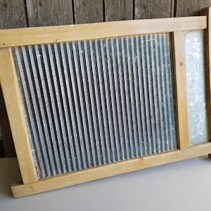 Vinage washboard. Old rustic washing board. Vintage farmhouse washboard. 1930s.
