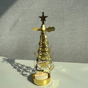 Spinning candle holders | Rotating candle, Carousel Tea light Holder, Merry-go-around, Christmas tealight holder, Rotary candle holders