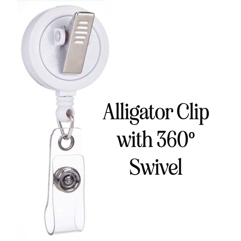 May include: A white retractable badge reel with an alligator clip and a clear vinyl strap. The reel has a 360-degree swivel feature. Text on the image reads "Alligator Clip with 360&deg; Swivel."